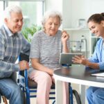 Nurse discussing care with senior couple