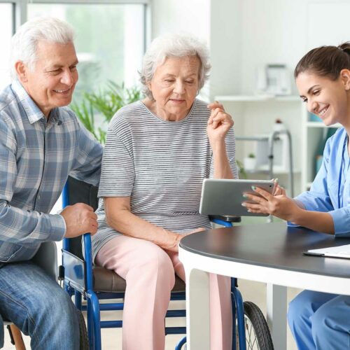 Nurse Discussing Care With Senior Couple