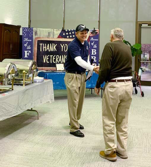 Veterans Day Event 2022 Veteran Handshake at the lunch buffet