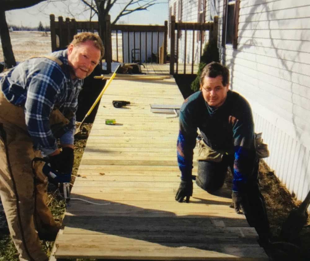 Volunteers building ramp - Reflecting on 40 Years