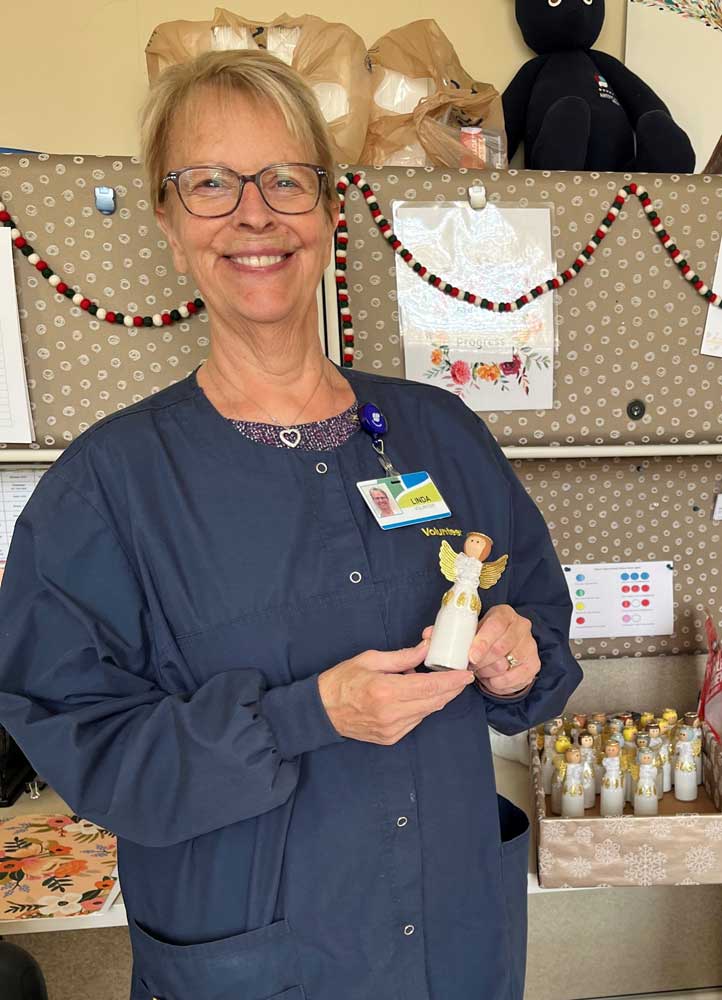 Volunteer Spotlight: Linda holding an angel