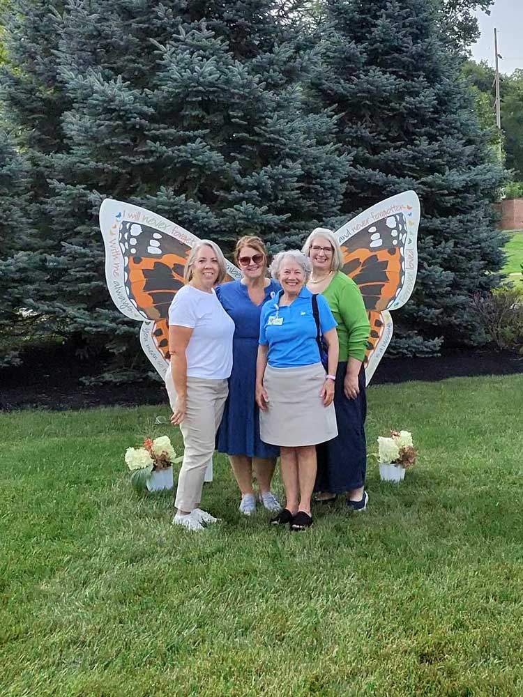 Ohio's Hospice Dayton Butterfly Release guests posing in front of wings