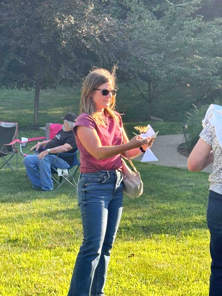 Guests releasing butterflies at Ohio's Hospice Butterfly Release