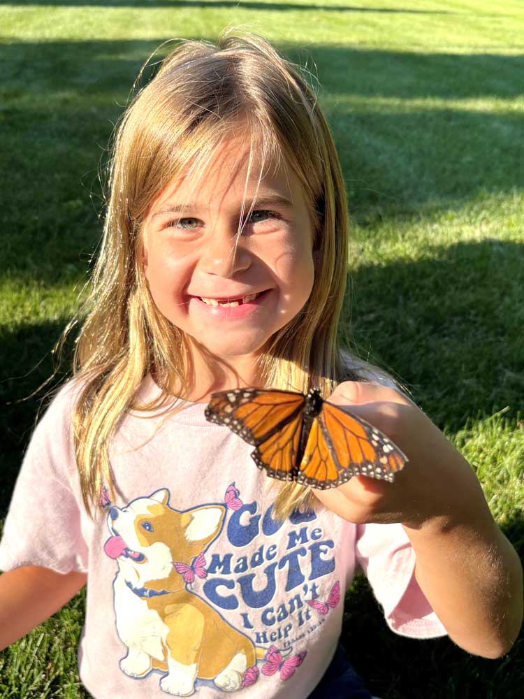 Butterfly on a little girl's hand at Ohio's Hospice Butterfly Release