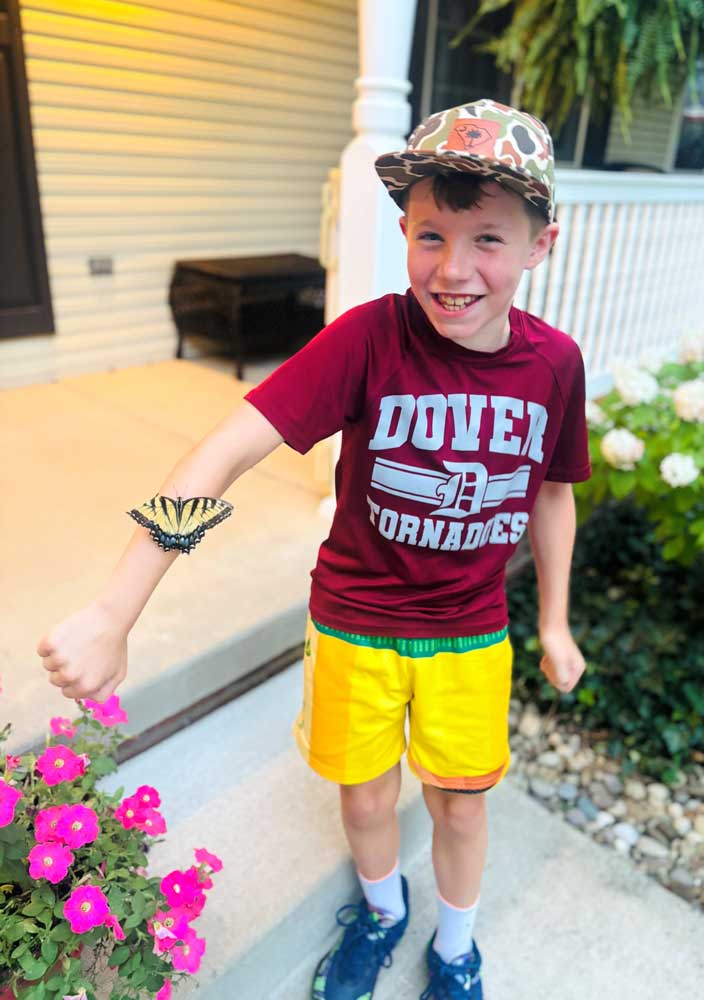 Butterfly on a little boy's arm at Ohio's Hospice Butterfly Release