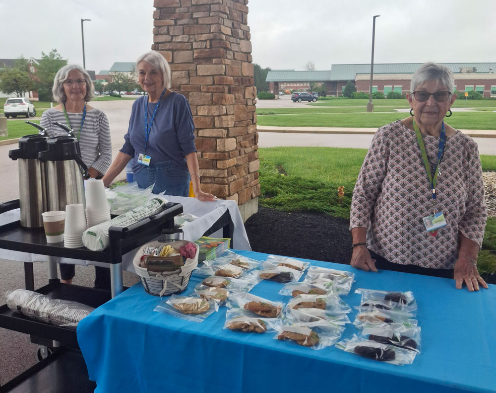 Troy Butterfly Release 2026 Volunteers passing out treats